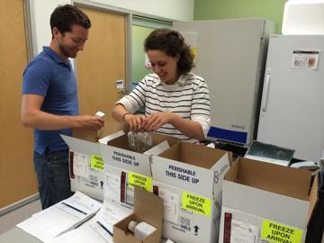 Mark Smith packages the samples for shipment on dry ice with a colleague.